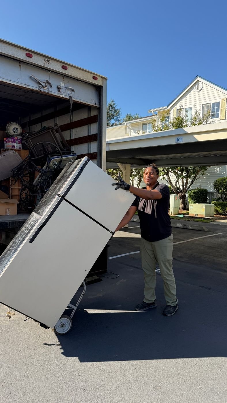 Crew loading a refrigerator into the truck in Kent