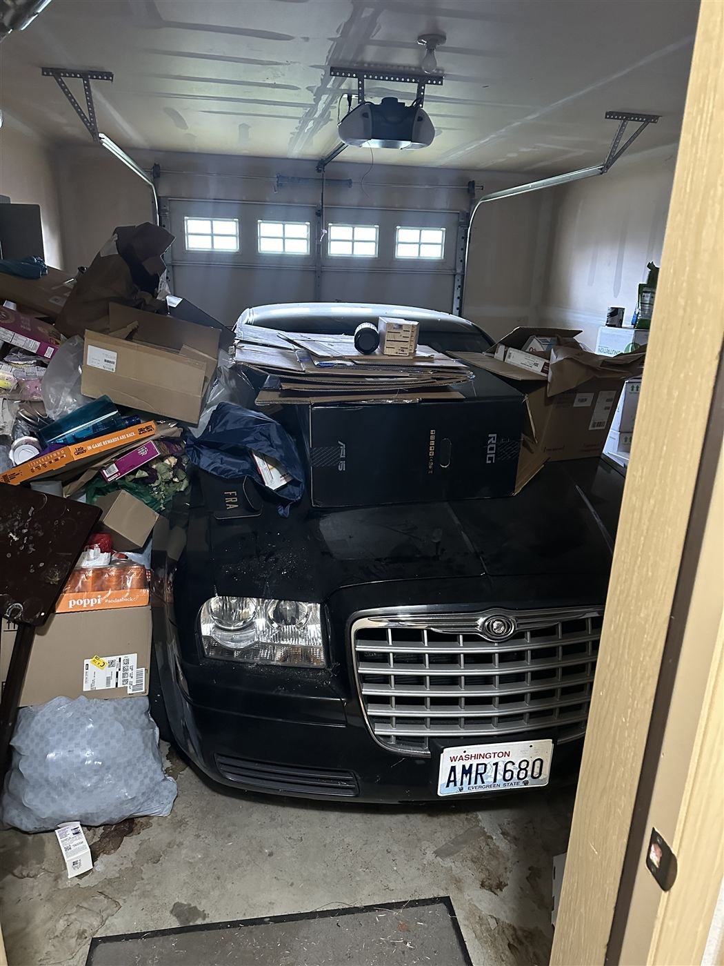 Garage packed with boxes before cleanup